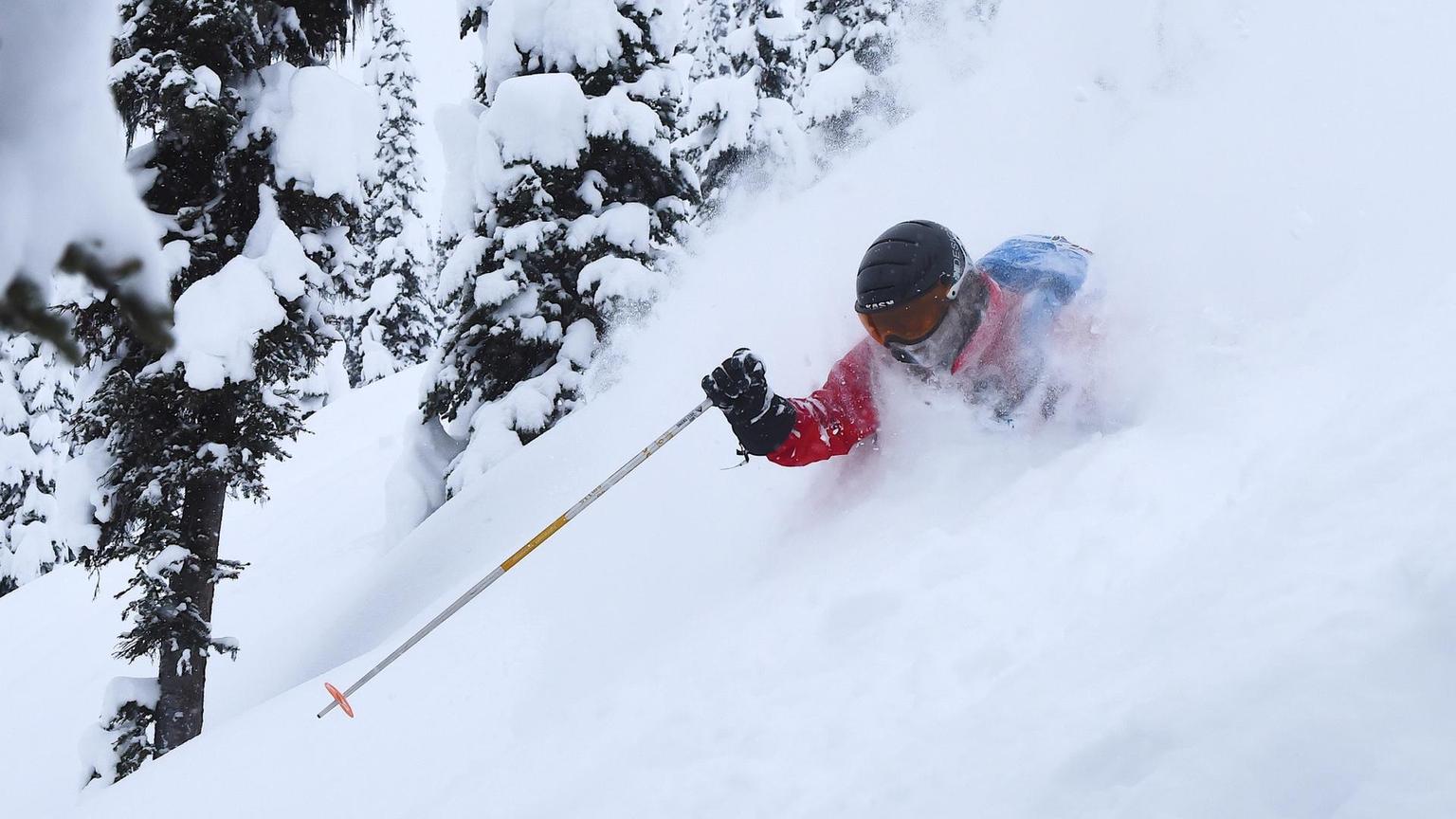 A skier in deep powder. 